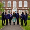 Mrs J. Fahey, Academy Headteacher, pictured with students outside Whalley Range 11-18 High School