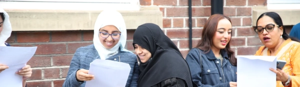 Students celebrate their results with family, on GCSE Results Day 2023
