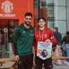 Arissa (Whalley Range alumna), being presented with the Community Captain’s armband and pennant by Bruno Fernandes in February 2024