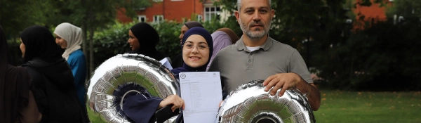 A student celebrates their results on GCSE Results Day 2025